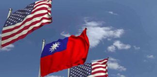 American and Taiwanese flags waving in the sky.