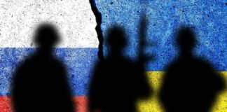 Soldiers silhouettes over divided flags of Russia Ukraine