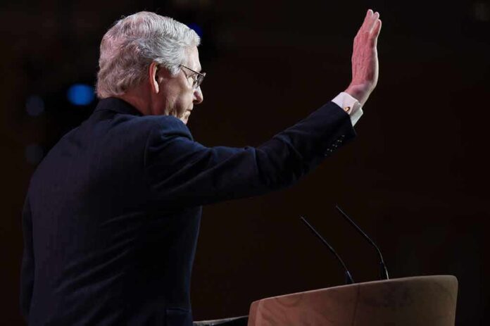 180961304 featured image Man raising hand behind podium.