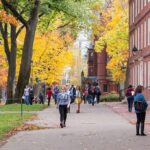 Mike Pompeo’s New Role at Columbia Sparks Controversy and Dialogue People walking on a college campus in autumn.