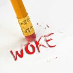 Debate Ignites Over Connecticut’s Emergency Bill on Health Funding and Rights Pencil erasing the word "woke" in red.