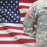 Legislative Boost for Medal of Honor Pensions; Arlington Museum Debuts US soldier in camouflage uniform with American flag