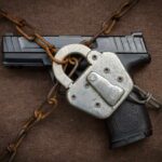 Senators Challenge Gun Control Measures, Demand ATF Policy Reversal Handgun secured with chains and padlock on cloth