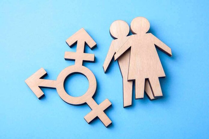 1145016626 featured image Wooden gender symbol and figures on blue background