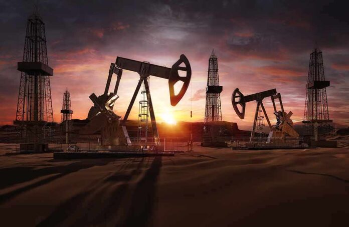 1667830870 featured image Oil rigs operating at sunset in a desert landscape.