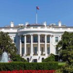 White House with fountain and flag visible