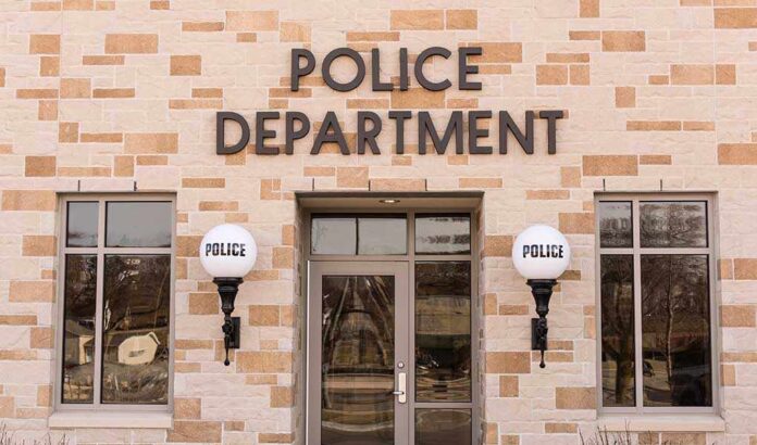 600837215 featured image Police department building with brick exterior and signage.