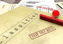 Classified documents with top secret stamps and stamp