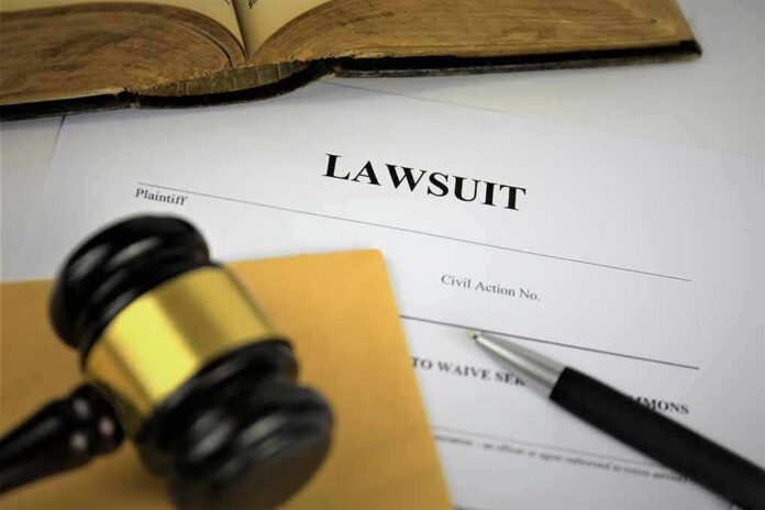 1236208948 featured image Lawsuit document with gavel, pen, and open book.