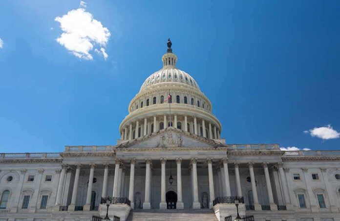 U.S. Capitol building against a clear blue sky.