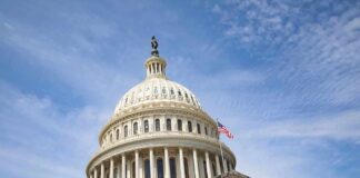 US Capitol Building with American flag flying