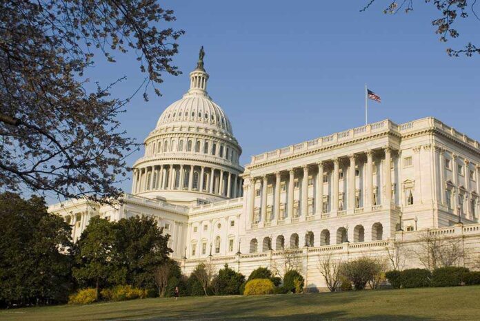 3033405 featured image United States Capitol building with surrounding trees.