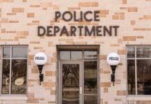 Police department building with brick exterior and signage.