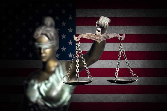 653491039 featured image Blindfolded Lady Justice in front of American flag