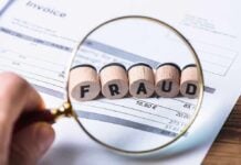 Magnifying glass showing fraud on an invoice.