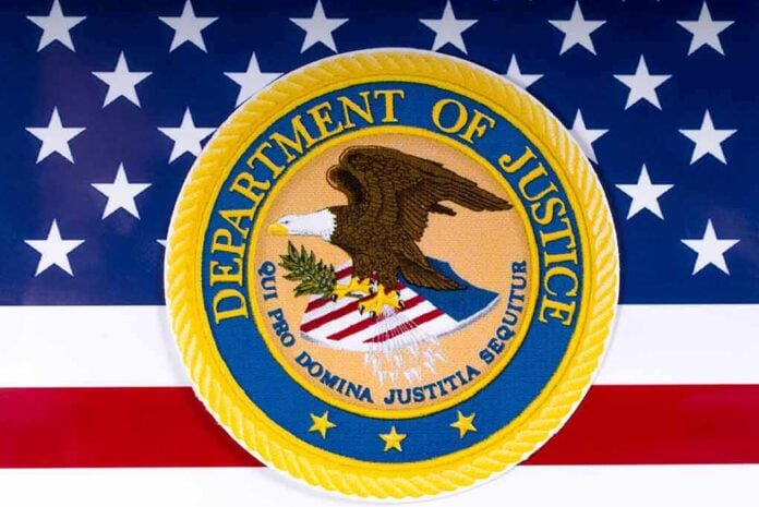 1054857686 featured image Department of Justice seal on American flag background