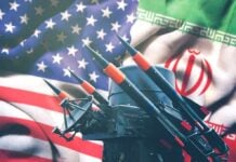 Iran and USA flags with missile launcher