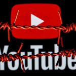 YouTube logo behind barbed wire lines