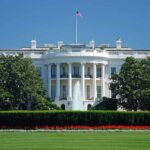 White House with American flag and fountain visible