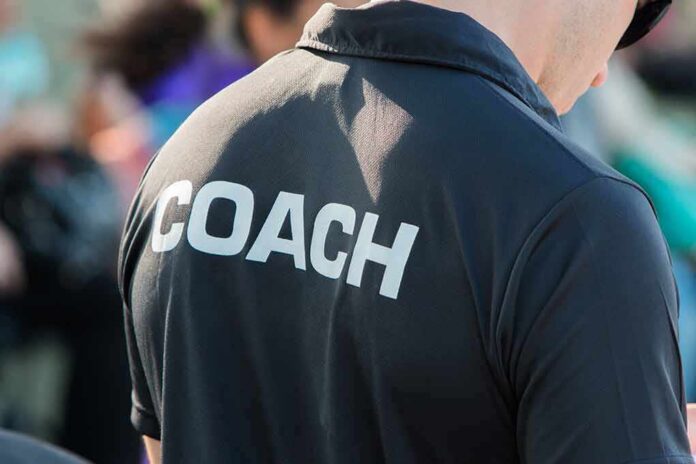 582703915 featured image Person wearing a shirt labeled Coach