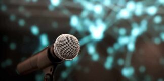 Microphone with abstract blurred blue background