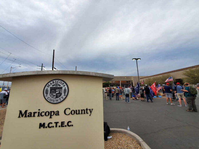 People gathered outside Maricopa County MCTEC building