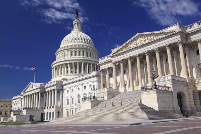 The US Capitol building with its dome and columns under a blue sky