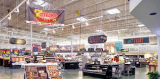 Supermarket interior with various food sections and displays