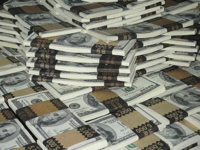 Piles of bundled cash stacked together