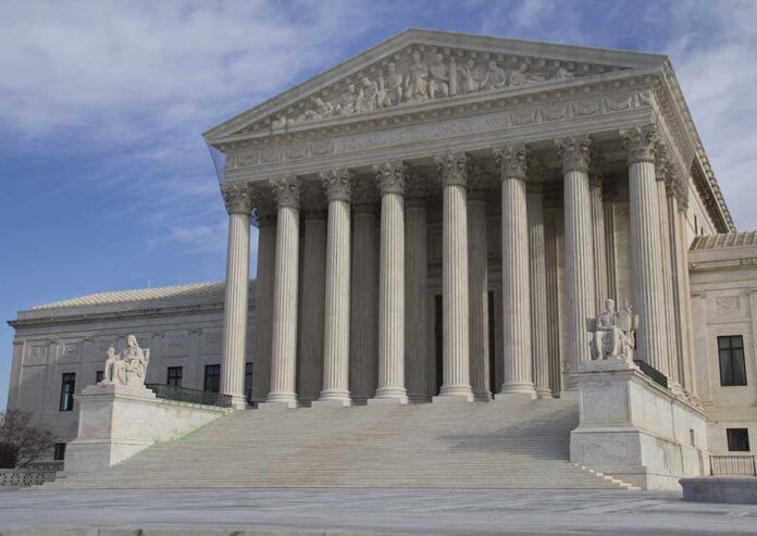 The Supreme Court building featuring large columns and statues