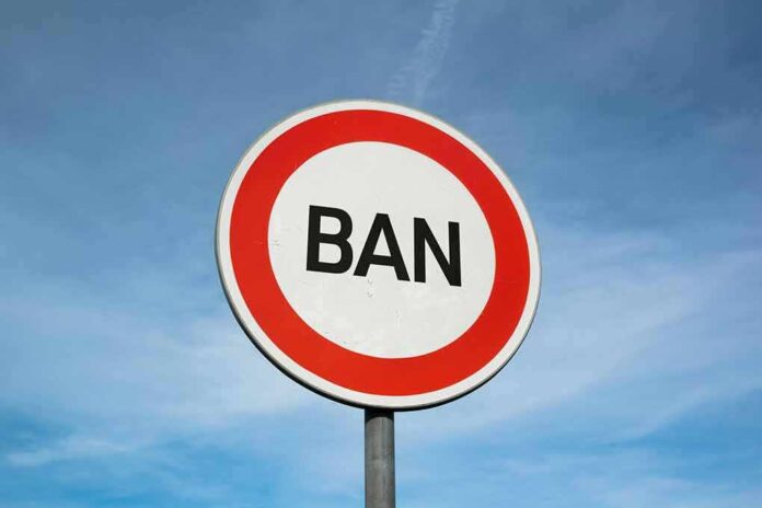 shutterstock_1759263689 (5).jpg A road sign displaying the word BAN against a blue sky