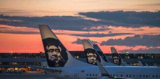 Airplanes with Alaska Airlines branding at sunset