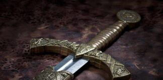 Close-up of an ornate decorative sword with a detailed hilt and blade