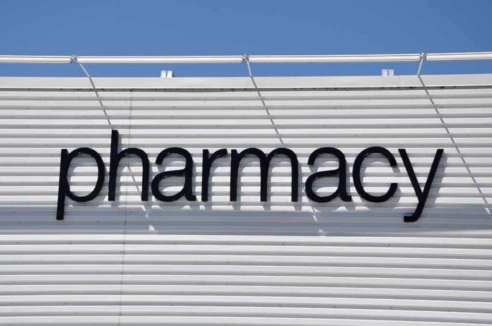 shutterstock_204507409.jpg Sign displaying the word pharmacy against a white background