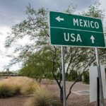 Road sign indicating directions to Mexico and the USA