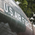 U.S. Air Force plane with trees in background.