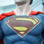 Disney’s HORRIFYING Safety BLUNDER–Hero SAVES THE DAY Close-up of a Superman statue wearing a blue costume and red cape