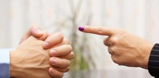 Two hands in a tense conversation, one hand pointing and the other clasped together