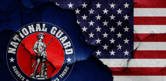 National Guard logo over a distressed American flag.