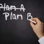 5 States GAMBLE Everything on Radical TAX Plan A hand writing Plan B on a chalkboard with Plan A crossed out