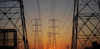 Cuba’s Grid Collapse: Trump’s Bold Gamble Transmission towers at sunset.