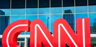 CNN Reporter Boosts Murder Fund—Then It Vanishes Large red CNN logo in front of a glass building