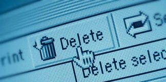 Close-up of a computer screen showing a delete button with a cursor hovering over it