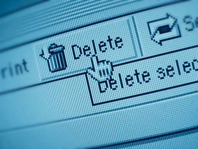 Close-up of a computer screen showing a delete button with a cursor hovering over it