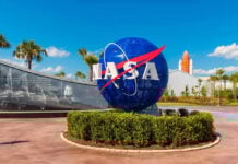 Toilet Catastrophe Exposes NASA’s Billion-Dollar Blunder NASA logo sculpture with spaceship and palm trees.