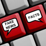 Keyboard keys labeled Fake News and Facts.