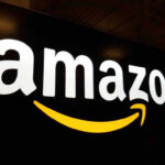 Amazon logo with yellow curved arrow underneath.