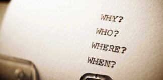Close-up of a typewritten page with four questions: Why, Who, Where, When