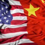 United States flag merged with China flag.