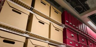 BOMBSHELL: Trump’s RELEASES UFO Files — What’s Still Hidden? Shelves filled with brown and red storage boxes for organizing documents